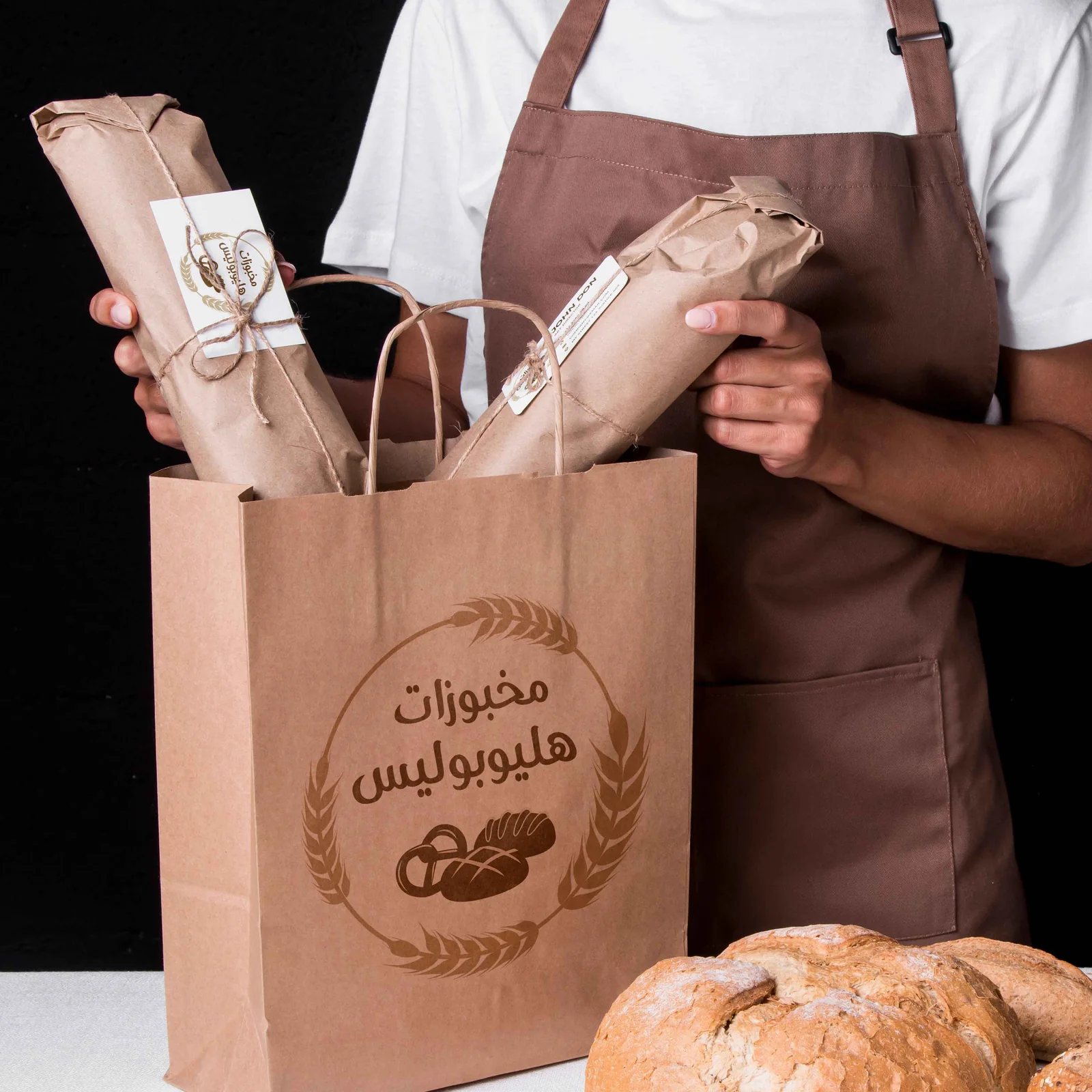 Kraft, chalk illustration, and an Arabic wordmark.